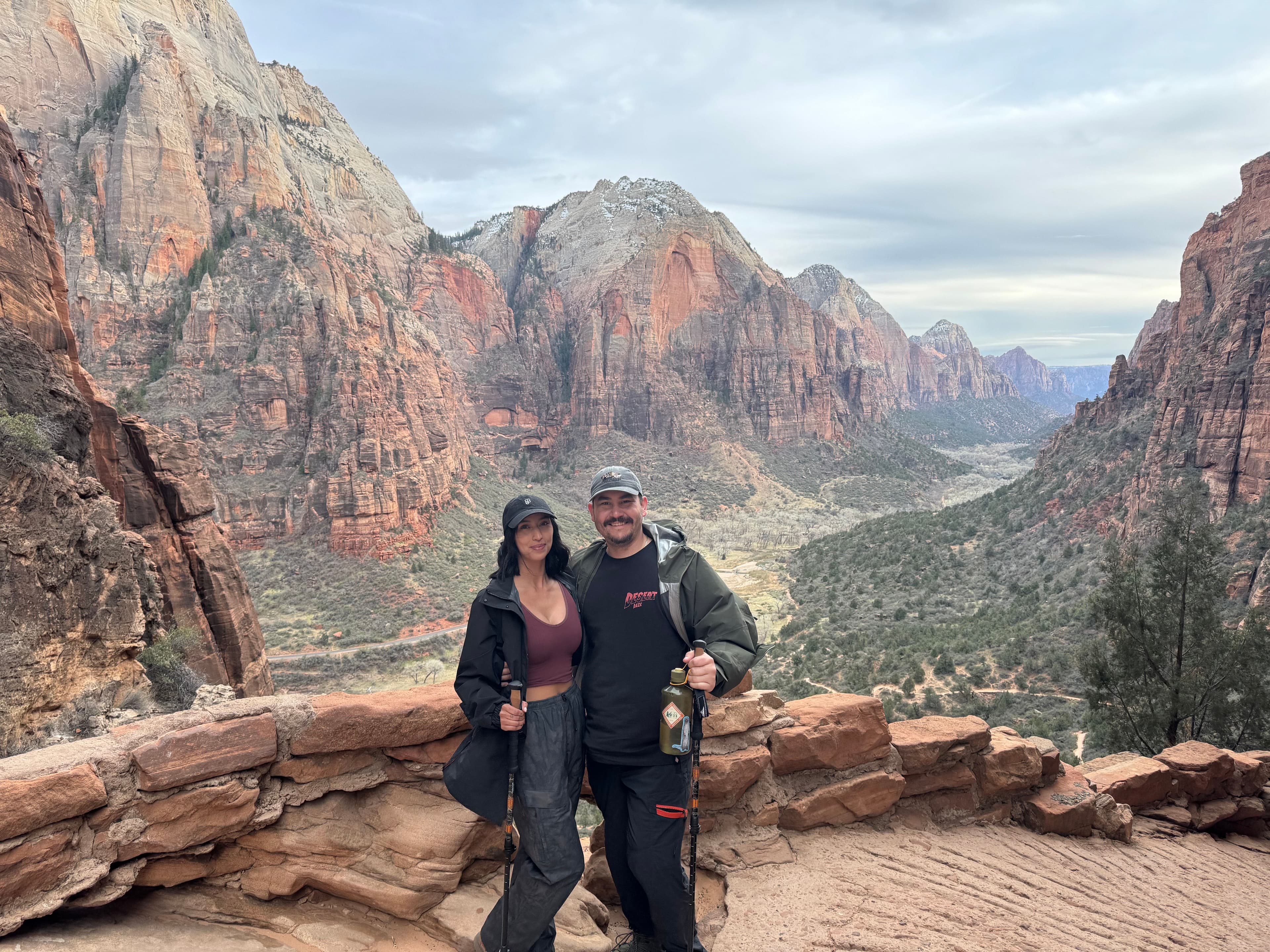 Michael and Ciara at Angel's Landing overlook in Zion National Park, with the canyon valley stretching behind them